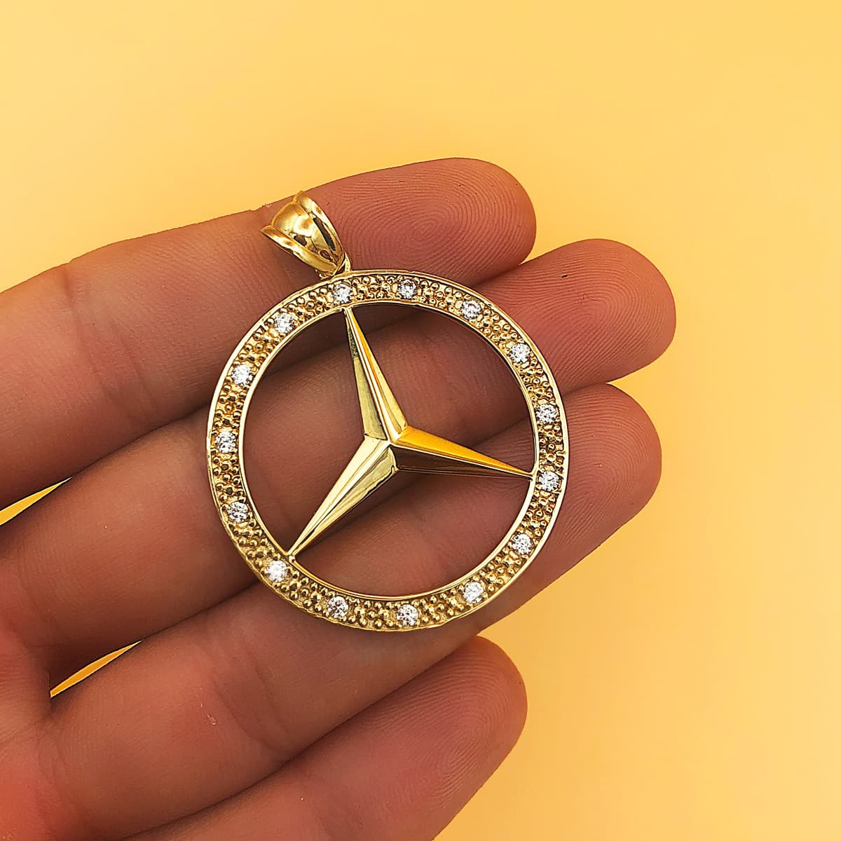 Medalla oro amarillo estrella con circonita 18k 35 mm